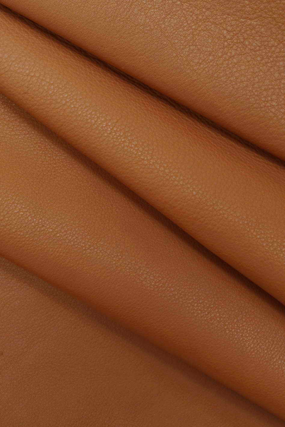 Italian leather, milled brick red half calfskin with slight irregular