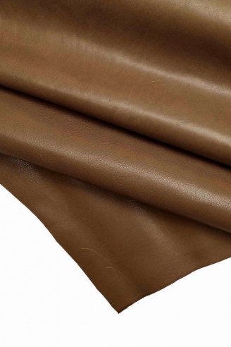 Italian leather, brown half calf with irregular grain, light and shade effects of color, glossy, size 35x29 inches