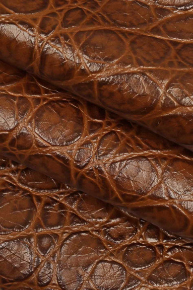 Crocodile embossed leather hide, brown crock printed calfskin, slightly wrinkled, glossy, soft skin