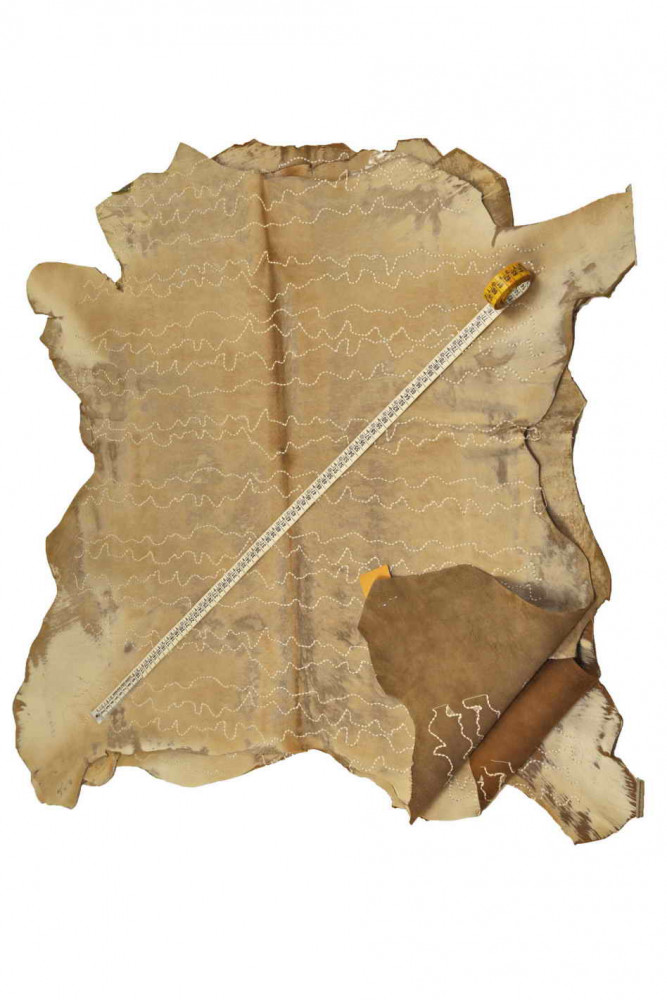 BEIGE HAIR on leather hide,...