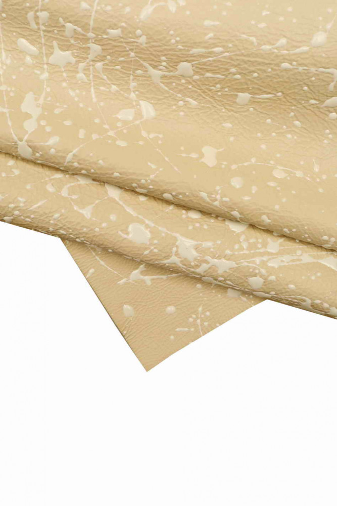 SPLASH print on cowhide, white relief texture on beige leather hide, sporty printed soft calfskin