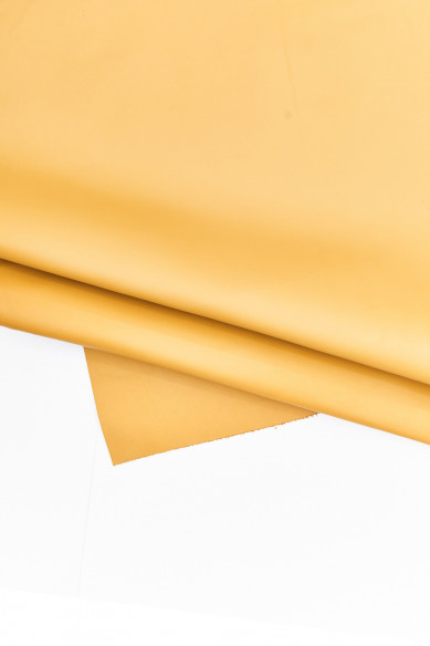 Assortment of 4 YELLOW leather hides, pack of matching printed perforated hair on leather skins and 1 smooth calfskin