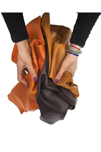 Orange, tan, brown sheepskin NAPPA, smooth soft lambskin leather hide for garments and craftings