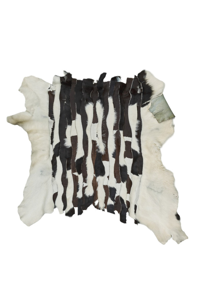 Cream and brown hair on leather hide,...